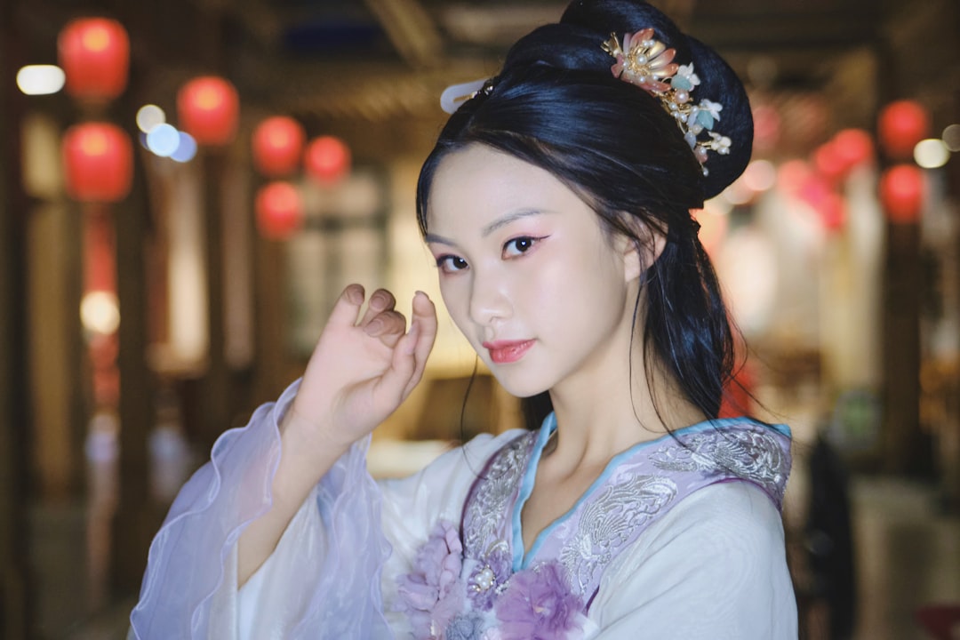 services-03 a-woman-in-a-traditional-chinese-dress-poses-for-a-picture-eejlk2rkhoi